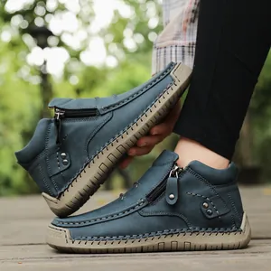 Side view of women's blue high-top handmade casual shoes featuring decorative side zipper