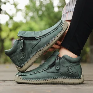 Detailed view of hand-stitched green high-top casual loafers with side zippers