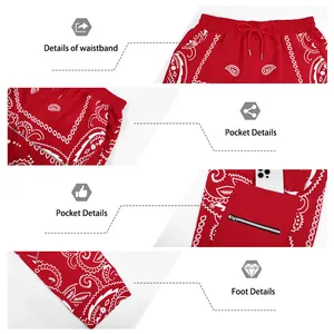 Detail view of red paisley hip-hop pants with elastic waist and zippered pockets
