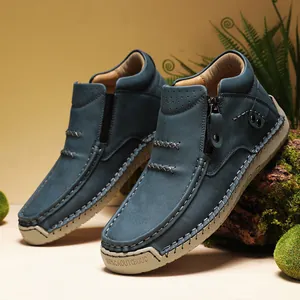 Close-up of blue high-top slip-on casual shoes with handmade stitching and zipper