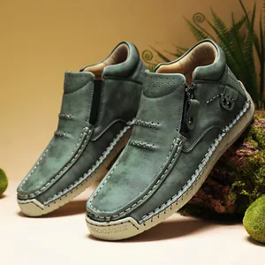 Detailed view of green high-top casual shoes with decorative stitching and zipper