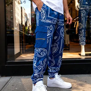 Close-up detail of men's blue bandana cargo pants styled in an urban street fashion setting