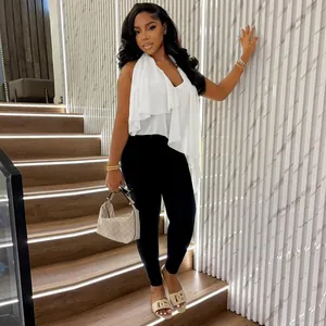 Close-up of white irregular halter neck top with sexy backless design and v-neck line