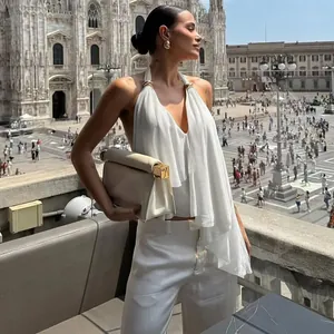 Elegant white halter neck backless camisole top with irregular hem and V-neckline