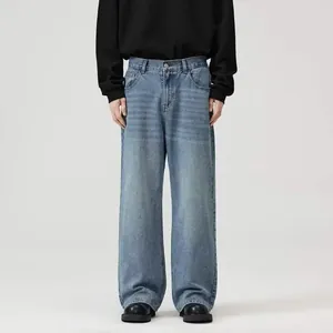 Full view of men's loose fit straight-leg jeans in washed light blue denim