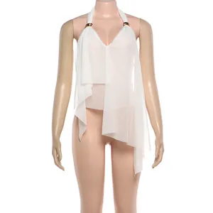 Detailed view of white halter neck top featuring an irregular hem and gold metal ring accents