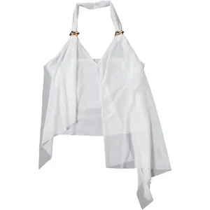 Detailed view of white halter neck top with gold rings and asymmetrical hemline