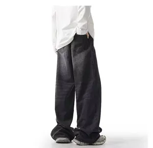 Rear view detail of men's loose-fit washed black straight-leg denim jeans for autumn