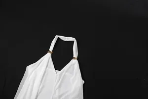 Close-up detail of a white sheer halter neck vest featuring elegant gold metal ring accents