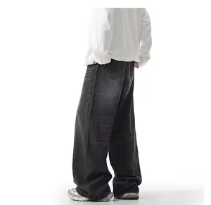 Detail back view of men's loose wide-leg washed black denim jeans with a baggy fit