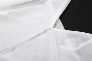 Close-up detail of white breathable mesh fabric on a sexy halter neck backless camisole.