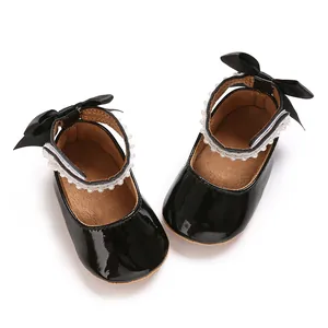 Black patent leather baby girl princess shoes with bow and pearl ankle strap detail