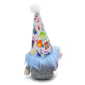 Detailed view of a birthday gnome plush with blue beard and Happy Birthday print hat