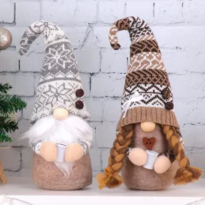 Detailed view of handmade coffee gnomes with knitted hats and micro coffee cups decor