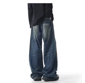 Detailed back view of men's wide-leg washed denim jeans with retro yellow mud dyeing effect