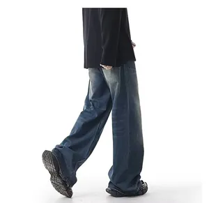 Detailed view of vintage washed loose fit straight leg wide denim jeans