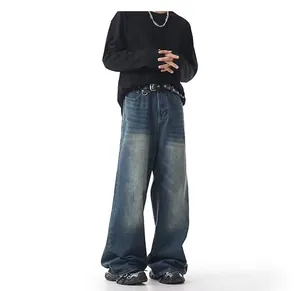 Men's vintage washed wide-leg jeans with a loose fit and distinctive faded effect.