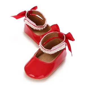 Elegant red patent leather baby girl princess shoes featuring lace trim and satin bows