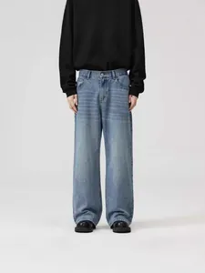 Men's loose fit straight wide-leg denim jeans featuring a vintage yellow mud wash style