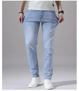 Men's light blue slim fit stretch denim jeans showing high fabric elasticity and comfort
