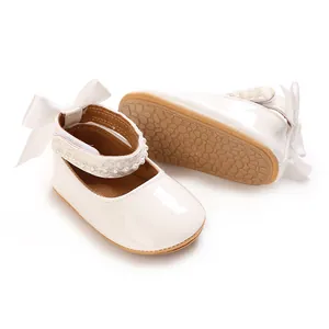 Detail view of white baby princess shoes showing soft sole and elegant pearl strap