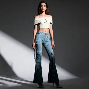 Fashion model wearing high-waisted light blue flare cargo jeans with pocket details