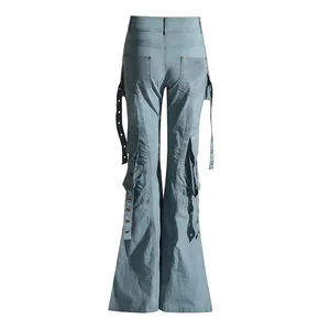 Detailed back view of light blue high-waisted flared jeans featuring metal eyelet strap accents