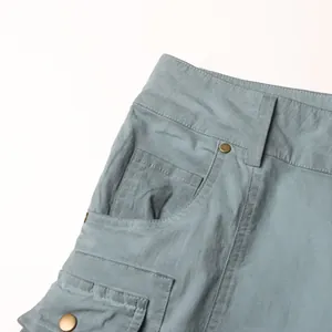 Detail view of high-waist flared denim pants showing pocket design and stitching