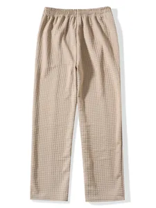 Detailed close-up showing the waffle knit texture of men's beige casual lounge pants