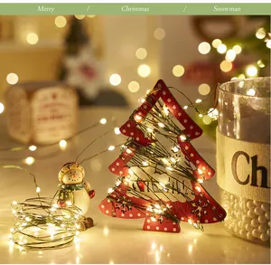 Warm white fairy lights wrapped on Christmas tree decor with festive bokeh lights