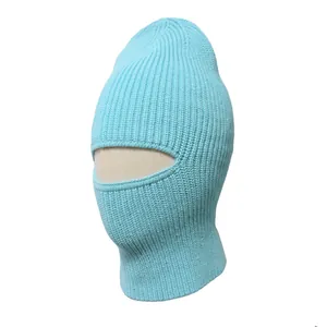 Side view of a light blue knitted thermal balaclava for winter cycling and wind protection.