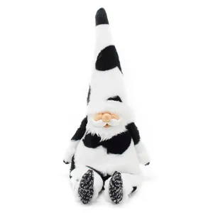 Plush cow gnome doll with black and white spotted hat and resin face details.