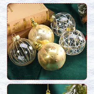 Close-up of elegant clear Christmas ornaments with gold and white glitter patterns