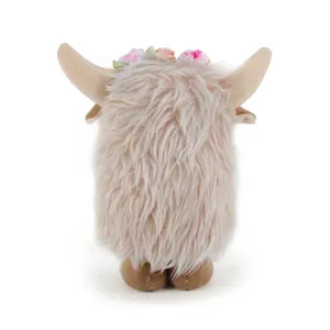 Rear view of pink plush highland cow doll showing long fluffy hair and flower crown