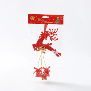 Detailed view of red reindeer Christmas hanging ornament with bells in retail packaging