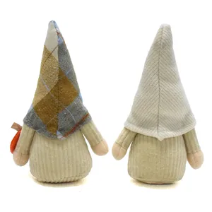 Back view of two harvest gnome plush dolls with autumn plaid and corduroy hats