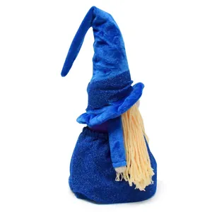 Side view of a blue wizard gnome doll with long yarn beard and glitter fabric base