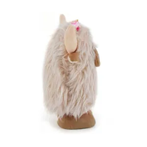 Detailed side view of a fluffy Highland Cow plush toy with long faux fur and horn detail
