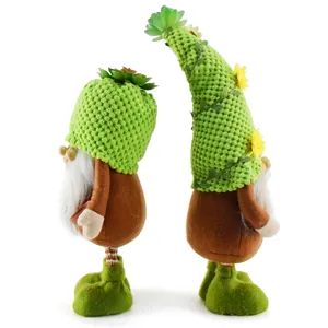 Detailed side view of two plush gnomes with green knitted hats and soft white beards.