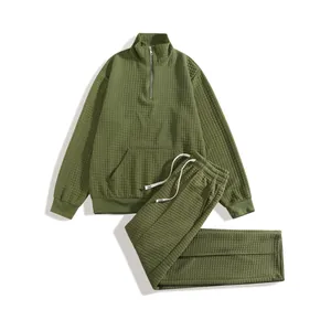 Men's olive green waffle knit tracksuit set with half-zip sweatshirt and drawstring pants