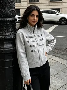 Chic gray zip-up jacket with military-style buttons for women in urban setting