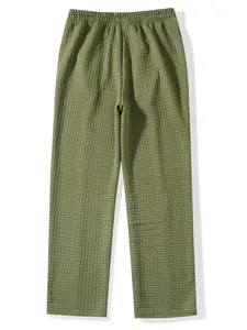 Full view of men's olive green waffle knit casual pants with elastic waistband.