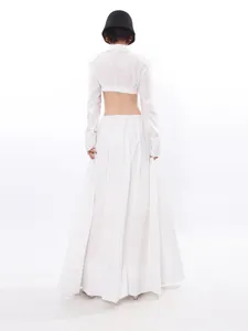 Elegant two-piece set featuring white cropped long sleeve top and long maxi skirt