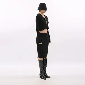 Elegant black two-piece knit set with cropped zip-up top and matching midi pencil skirt.