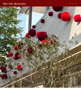 Outdoor commercial festive display with burgundy velvet balls for New Year decor