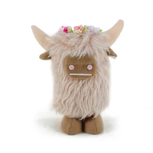 Soft Highland Cow plush doll featuring long fluffy fur and colorful floral crown detail