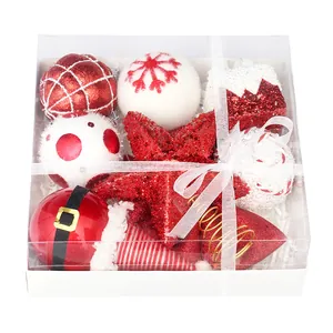 Festive red and white Christmas ornament set in clear gift box with white ribbon bow