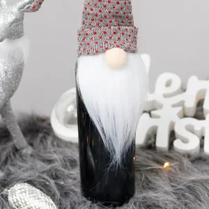 Festive Christmas gnome wine bottle cover with grey heart-patterned hat and beard