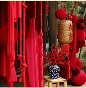Close-up of burgundy velvet balls and festive lanterns for Chinese New Year decor