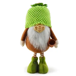 Detail shot of a whimsical garden gnome figurine with green knitted hat and flower pot